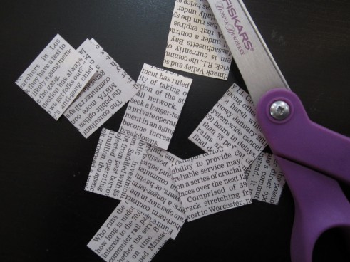 cut out 10 small pieces of newspaper